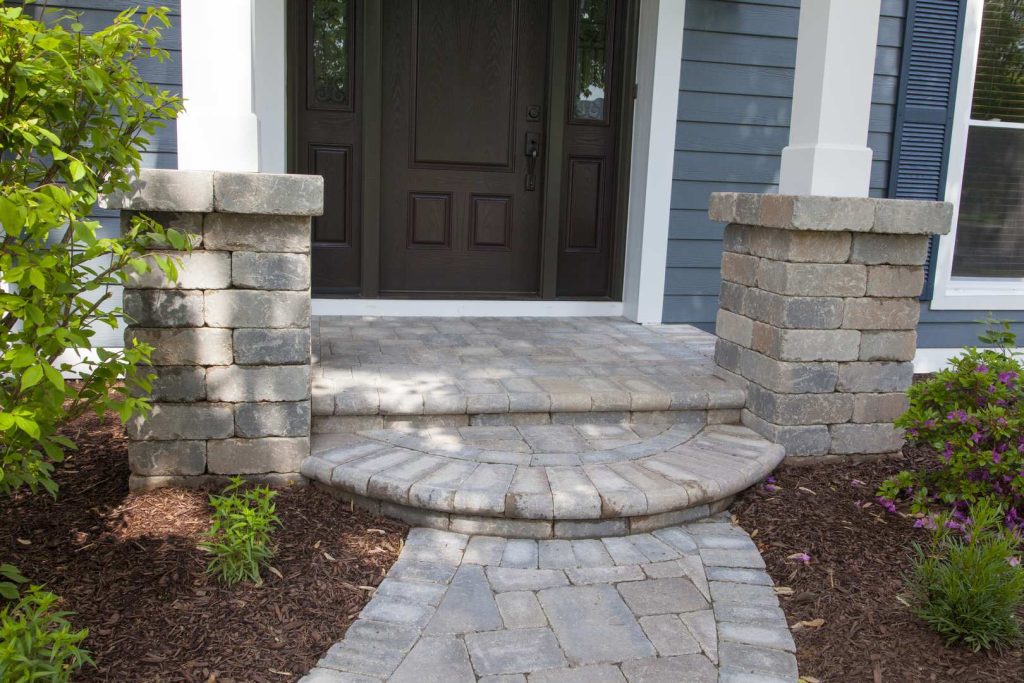 This is an example of a small traditional stone front porch design in Chicago with a roof extension. by Opal Enterprises, Inc. | Outdoor Photos | Porch | Landscaping | Landscape Design | Outdoor Living Space | Porch Design Ideas | Outdoor Living Space Ideas | Backyard Design