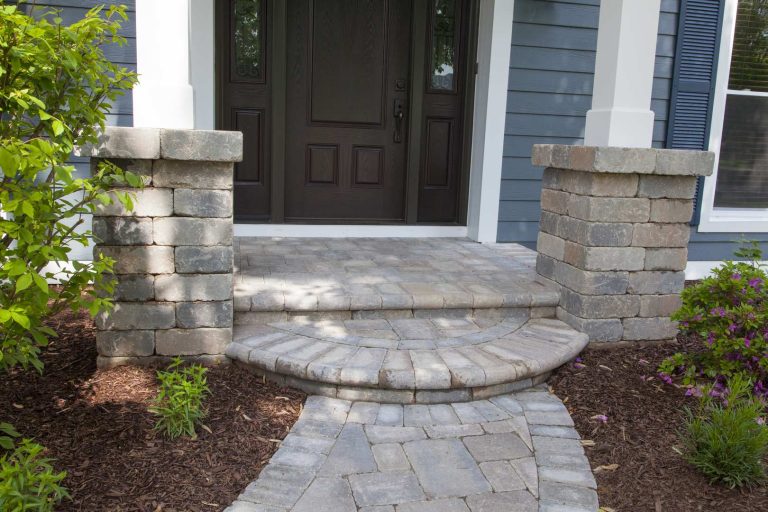 This is an example of a small traditional stone front porch design in Chicago with a roof extension. by Opal Enterprises, Inc. | Outdoor Photos | Porch | Landscaping | Landscape Design | Outdoor Living Space | Porch Design Ideas | Outdoor Living Space Ideas | Backyard Design
