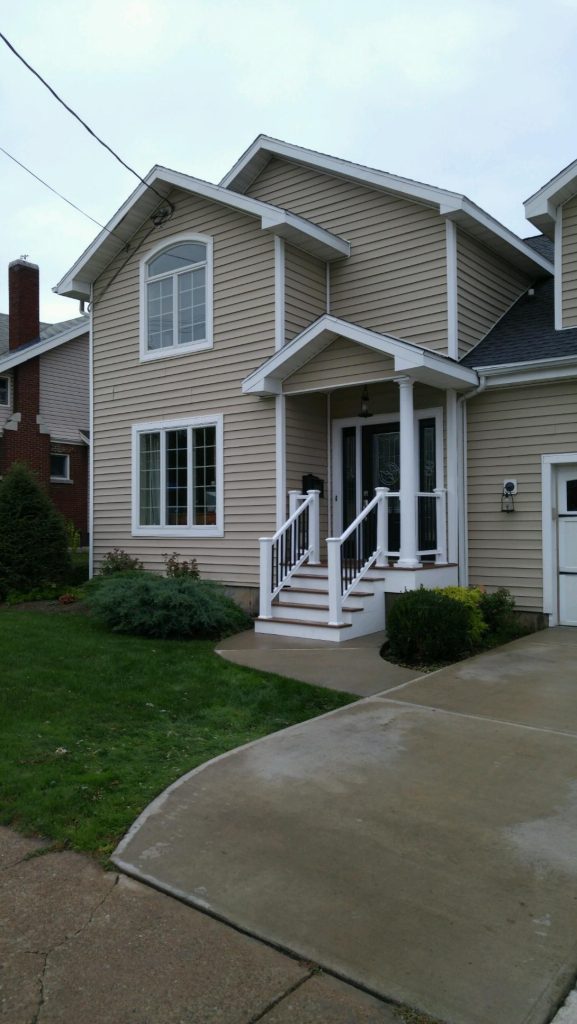 This is an example of a small transitional front porch design in Boston with decking and a roof extension. by Home Improvement Liquidation Outlet | Outdoor Photos | Porch | Landscaping | Landscape Design | Outdoor Living Space | Porch Design Ideas | Outdoor Living Space Ideas | Backyard Design