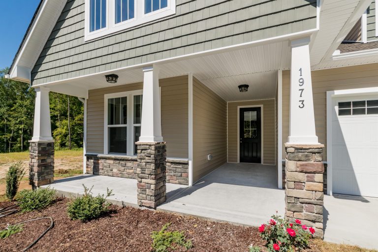 This is an example of a small transitional front porch design in Raleigh. by Cimarron Homes | Outdoor Photos | Porch | Landscaping | Landscape Design | Outdoor Living Space | Porch Design Ideas | Outdoor Living Space Ideas | Backyard Design