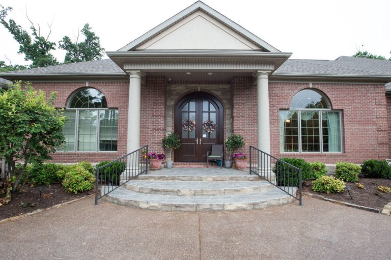 This is an example of a stone front porch design in Other with a roof extension. by Reinbrecht Homes & Construction | Outdoor Photos | Porch | Landscaping | Landscape Design | Outdoor Living Space | Porch Design Ideas | Outdoor Living Space Ideas | Backyard Design
