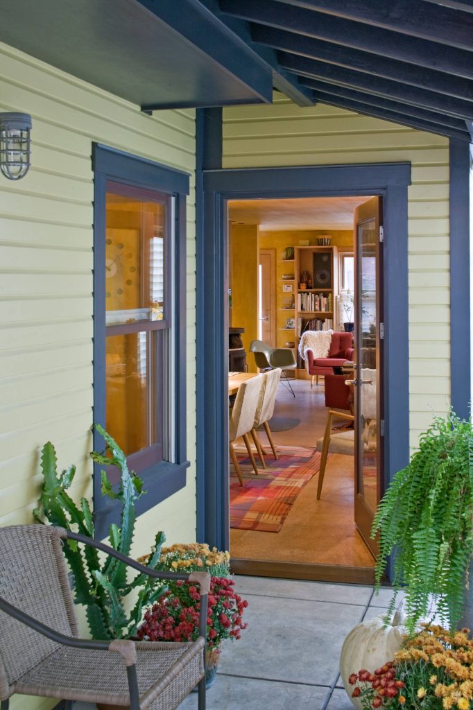 This is an example of a traditional concrete back porch design in Other with a roof extension. by Gerald Lee Morosco Architects, PC | Outdoor Photos | Porch | Landscaping | Landscape Design | Outdoor Living Space | Porch Design Ideas | Outdoor Living Space Ideas | Backyard Design