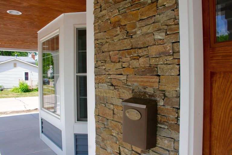 This is an example of a traditional concrete front porch design in Detroit with a roof extension. by Oliver Construction, Inc. | Outdoor Photos | Porch | Landscaping | Landscape Design | Outdoor Living Space | Porch Design Ideas | Outdoor Living Space Ideas | Backyard Design