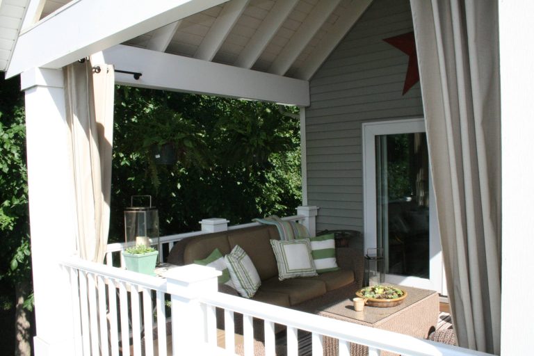 This is an example of a traditional porch design in Grand Rapids. by Dwellings | Outdoor Photos | Porch | Landscaping | Landscape Design | Outdoor Living Space | Porch Design Ideas | Outdoor Living Space Ideas | Backyard Design
