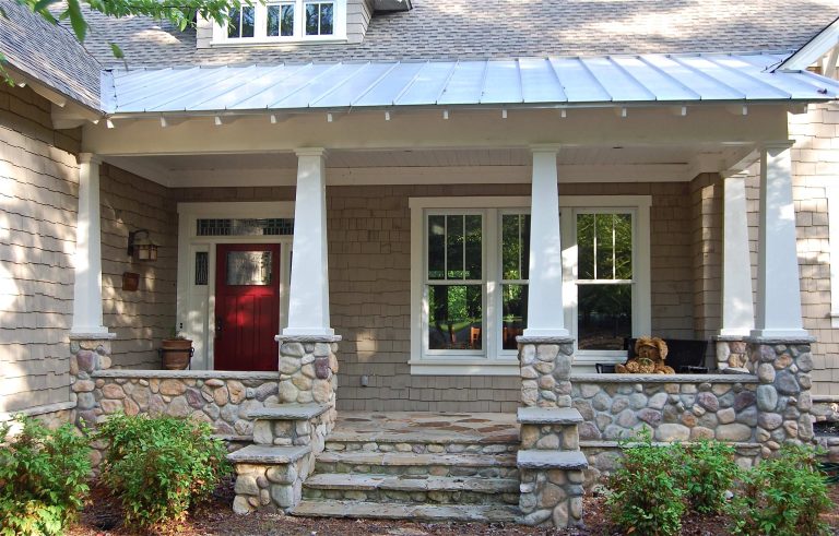 This is an example of a traditional stone porch design in Other with a roof extension. by DreamBuilt, Inc. | Outdoor Photos | Porch | Landscaping | Landscape Design | Outdoor Living Space | Porch Design Ideas | Outdoor Living Space Ideas | Backyard Design