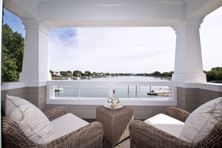 This is an example of a transitional back porch design in New York with a roof extension. by Kelsey Johnston Interiors | Outdoor Photos | Porch | Landscaping | Landscape Design | Outdoor Living Space | Porch Design Ideas | Outdoor Living Space Ideas | Backyard Design