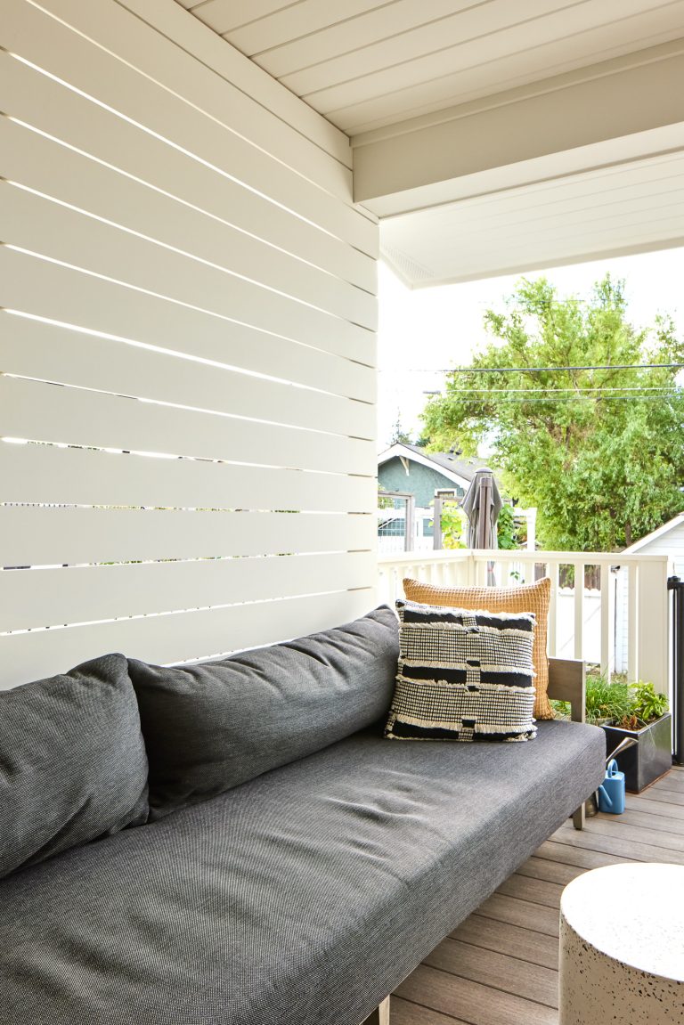 This is an example of a transitional back porch design in Seattle with a roof extension. by Model Remodel | Outdoor Photos | Porch | Landscaping | Landscape Design | Outdoor Living Space | Porch Design Ideas | Outdoor Living Space Ideas | Backyard Design