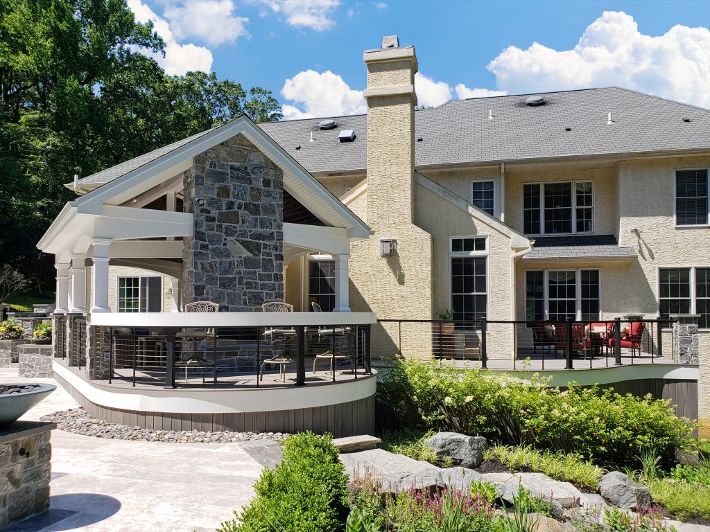 This is an example of a transitional metal railing back porch design in Other with a fireplace. by Keystone Custom Decks | Outdoor Photos | Porch | Landscaping | Landscape Design | Outdoor Living Space | Porch Design Ideas | Outdoor Living Space Ideas | Backyard Design