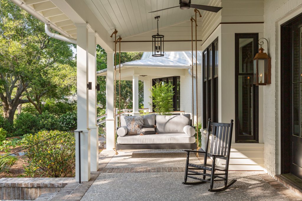 This is an example of a transitional mixed material railing porch design in Charleston with a roof extension. by Herlong Architects | Outdoor Photos | Porch | Landscaping | Landscape Design | Outdoor Living Space | Porch Design Ideas | Outdoor Living Space Ideas | Backyard Design