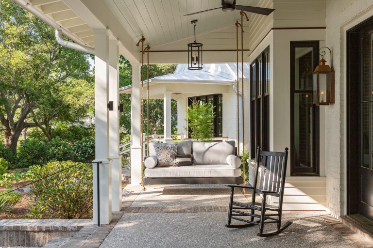 This is an example of a transitional mixed material railing porch design in Charleston with a roof extension. by Herlong Architects | Outdoor Photos | Porch | Landscaping | Landscape Design | Outdoor Living Space | Porch Design Ideas | Outdoor Living Space Ideas | Backyard Design