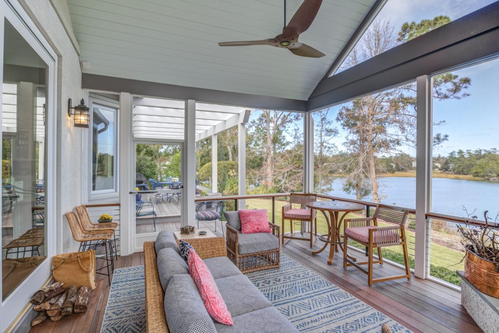 This is an example of a transitional screened-in and cable railing porch design in Other with decking and a roof extension. by Konrady & Son Construction, LLC | Outdoor Photos | Porch | Landscaping | Landscape Design | Outdoor Living Space | Porch Design Ideas | Outdoor Living Space Ideas | Backyard Design
