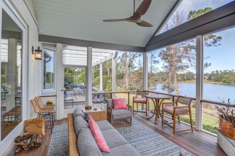 This is an example of a transitional screened-in and cable railing porch design in Other with decking and a roof extension. by Konrady & Son Construction, LLC | Outdoor Photos | Porch | Landscaping | Landscape Design | Outdoor Living Space | Porch Design Ideas | Outdoor Living Space Ideas | Backyard Design