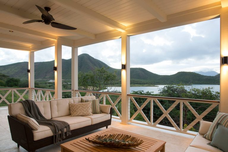 This is an example of a tropical back porch design in Charleston with a roof extension. by Herlong Architects | Outdoor Photos | Porch | Landscaping | Landscape Design | Outdoor Living Space | Porch Design Ideas | Outdoor Living Space Ideas | Backyard Design