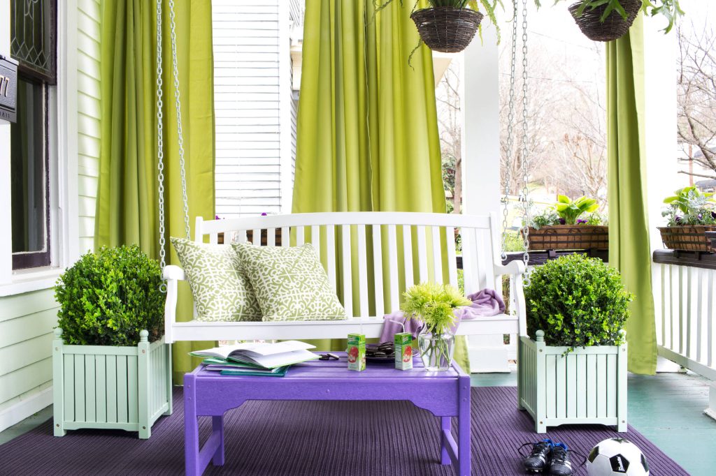 This is an example of an eclectic porch design in Omaha. by Hayneedle | Outdoor Photos | Porch | Landscaping | Landscape Design | Outdoor Living Space | Porch Design Ideas | Outdoor Living Space Ideas | Backyard Design