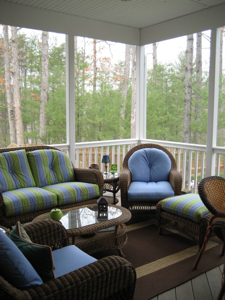 This is an example of an eclectic side porch design in DC Metro with a roof extension. by Graystone Homes, Inc. | Outdoor Photos | Porch | Landscaping | Landscape Design | Outdoor Living Space | Porch Design Ideas | Outdoor Living Space Ideas | Backyard Design