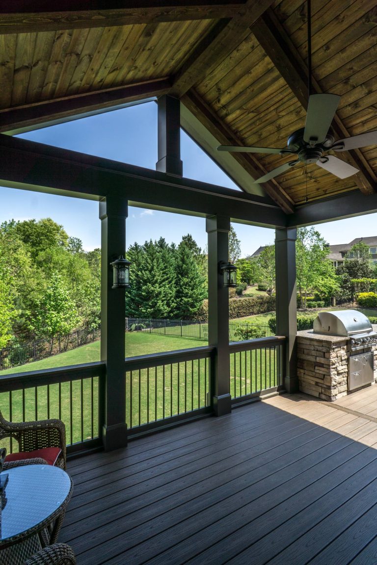 This open porch next to the screen porch creates a transition to the open deck and outdoor kitchen. The Trex Transcend decking keeps the maintenance low with just an annual cleaning by Decksouth | Outdoor Photos | Porch | Landscaping | Landscape Design | Outdoor Living Space | Porch Design Ideas | Outdoor Living Space Ideas | Backyard Design