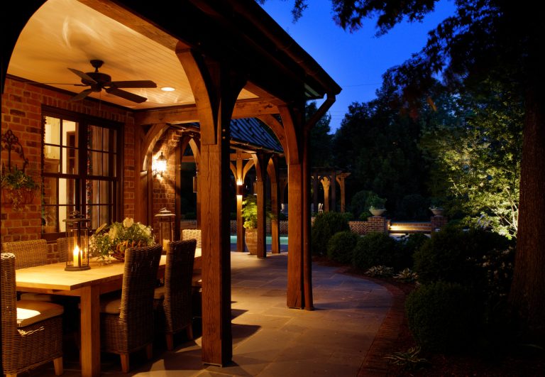 This outdoor dining area is an inviting space with easy access to the porch and pool addition. Photo by kip dawkins photography