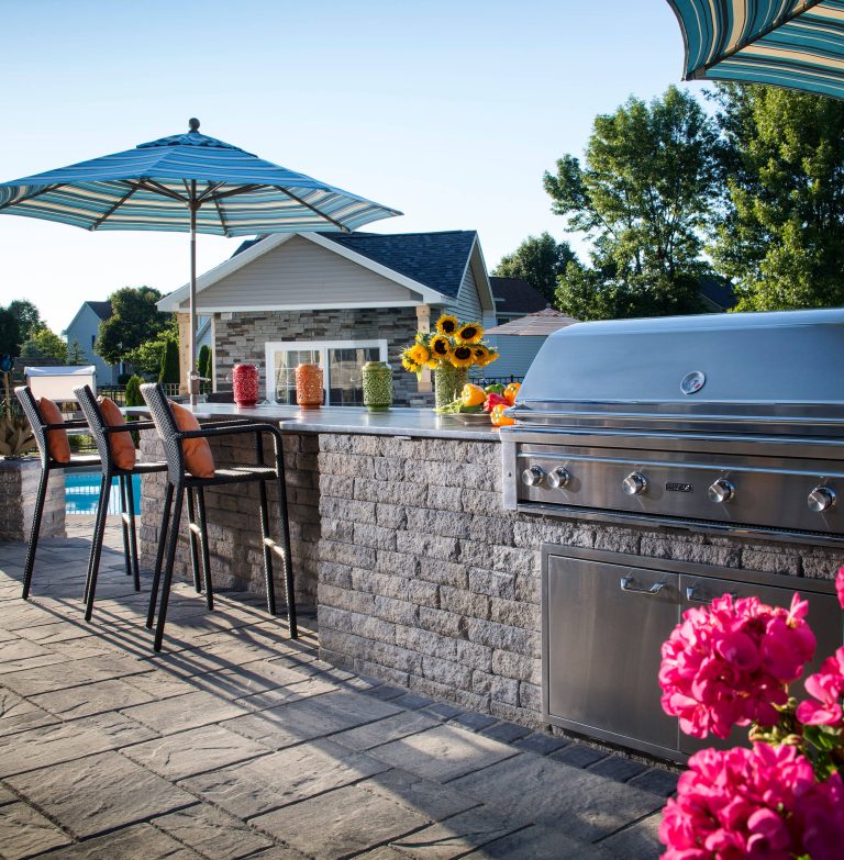 This outdoor kitchen became an extension of the house by using complementary materials and colors.