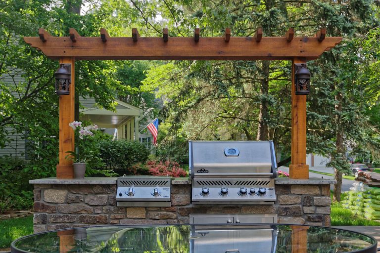 This outdoor space is perfect for barbecues and gatherings. We built a patio, built-in grill and gazebo to give these homeowners the perfect little backyard retreat