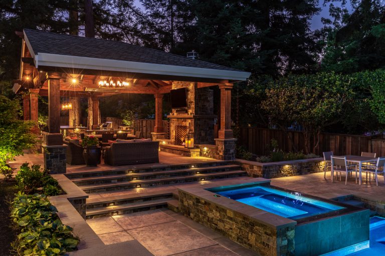 This pavilion exudes a cabin in the woods with no luxury lost. Whether it is day or night, with plenty of adequate lighting, this outdoor living space can be enjoyed at any given time.

by B. Gordon Builders, Inc. | Outdoor Kitchens | Backyard Design | Outdoor Living Spaces | Landscape Design