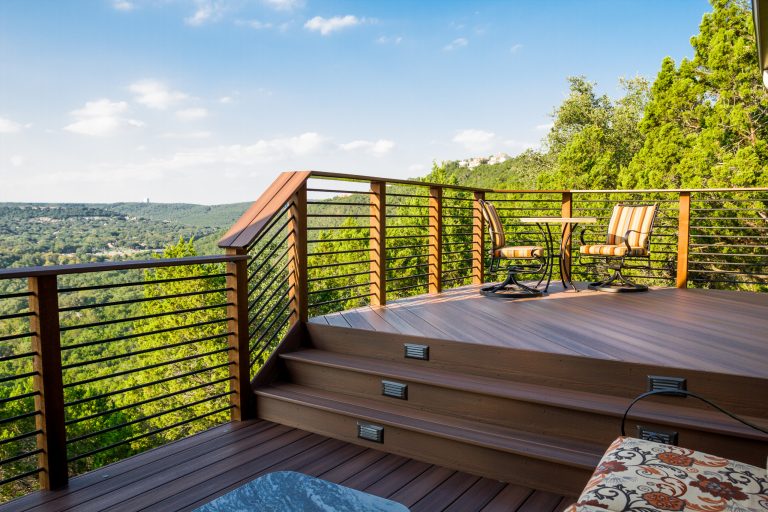 This railing system offers safety without distracting from the view. Designed & built by Jim Odom at Archadeck Austin. Photo Credit: Kristian Alveo & TimberTown