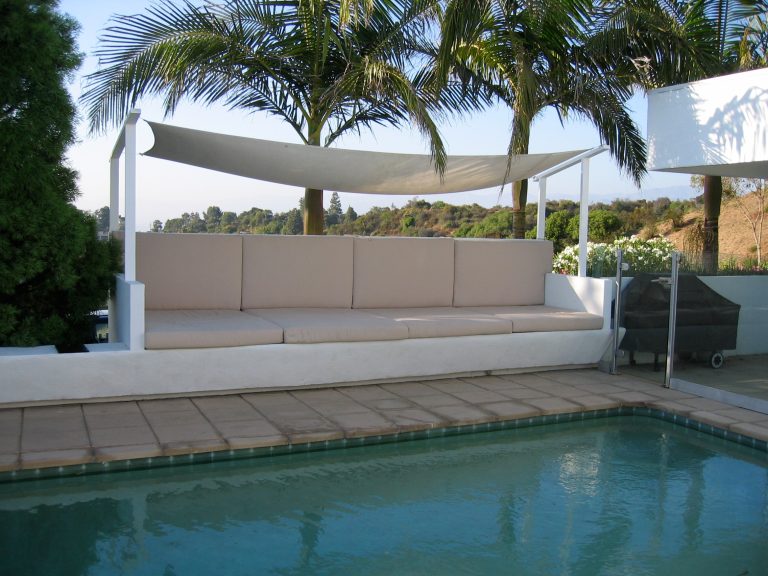 This was a project where the owner wanted to create a hotel pool side cabana atmosphere. Benches were built on walls around the pool.