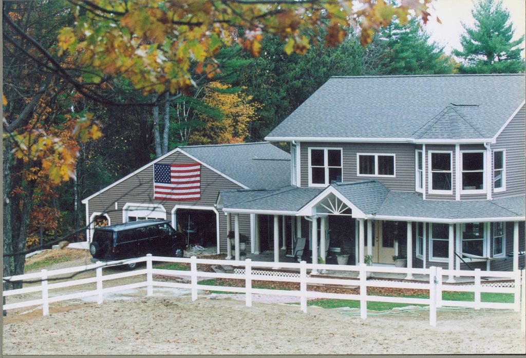 This wrap around farmers porch with 2 gables and mahogany decking is breathtaking! This porch makes the house feel warmer and more inviting. The custom sunburst in the gable finishes the look! by JWS Custom Decks LLC | Outdoor Photos | Porch | Landscaping | Landscape Design | Outdoor Living Space | Porch Design Ideas | Outdoor Living Space Ideas | Backyard Design