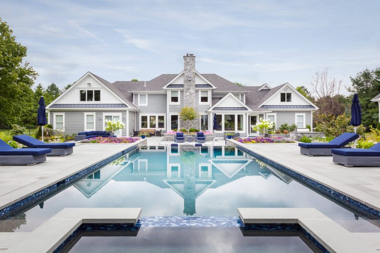 Thisis looking at the rear of the house from the cabana. This infinity edge pool, hot tub area looks a four star resort.