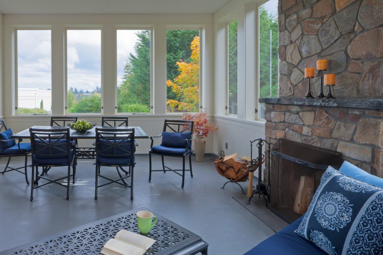 Three Season Porch with Fireplace Photo by Sozhino Imagery