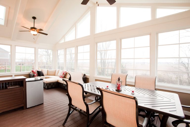 Three-season porch addition is large enough to fill entertaining and relaxation needs of the family.