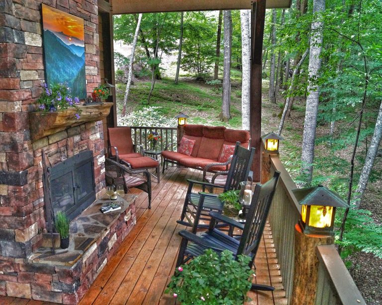 Timber Framed Covered porch with outdoor fireplace. So serene with the sounds of the stream.