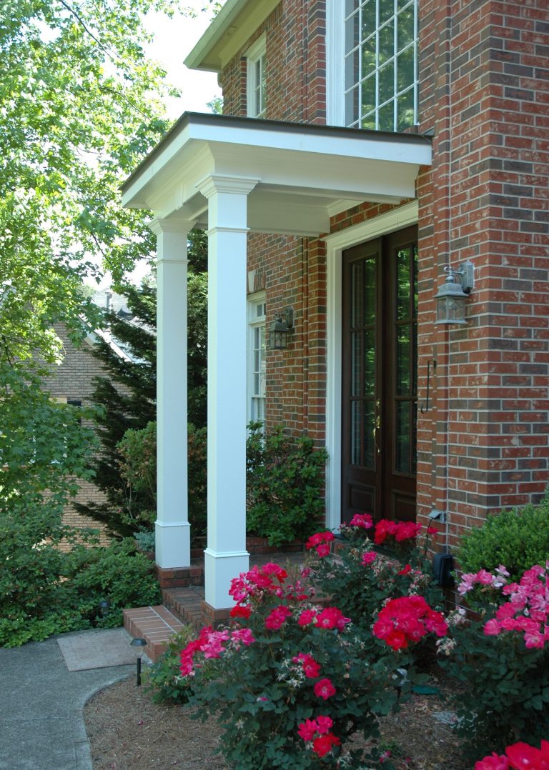 Traditional 2 column shed roof portico with curved railing. Designed and built by Georgia Front Porch.
