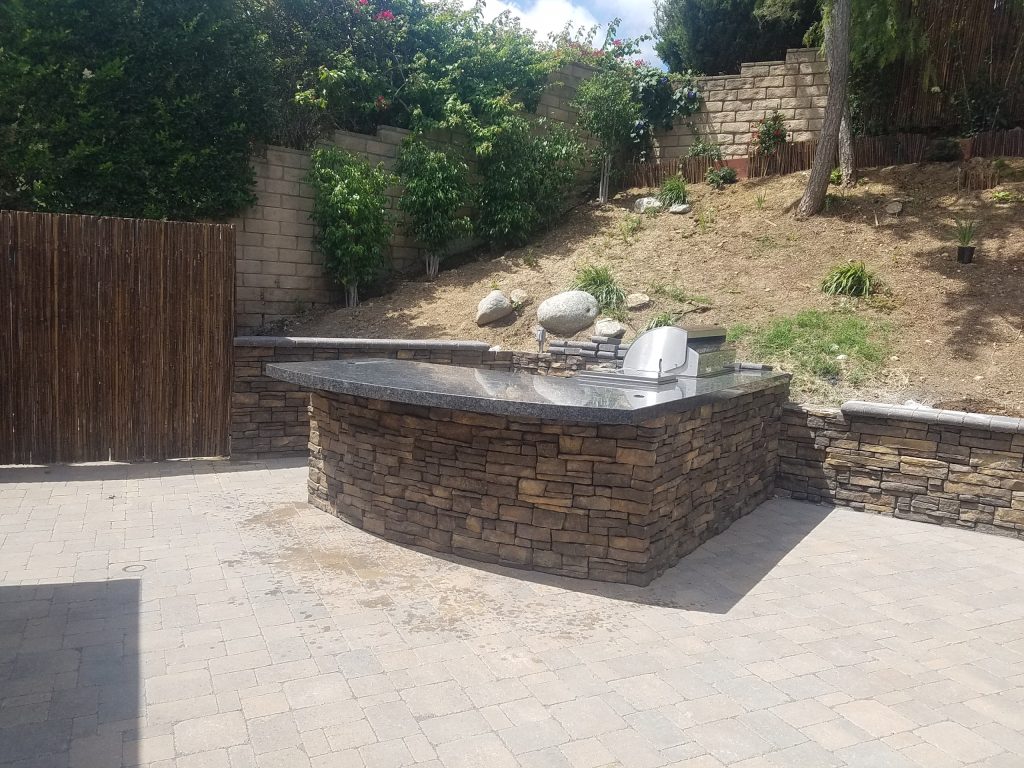 Traditional L-shaped Island with stone walls