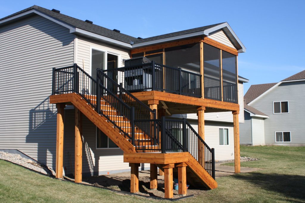 Traditional porch and deck project on back of house with Williams-Interlocking™ aluminum railing.