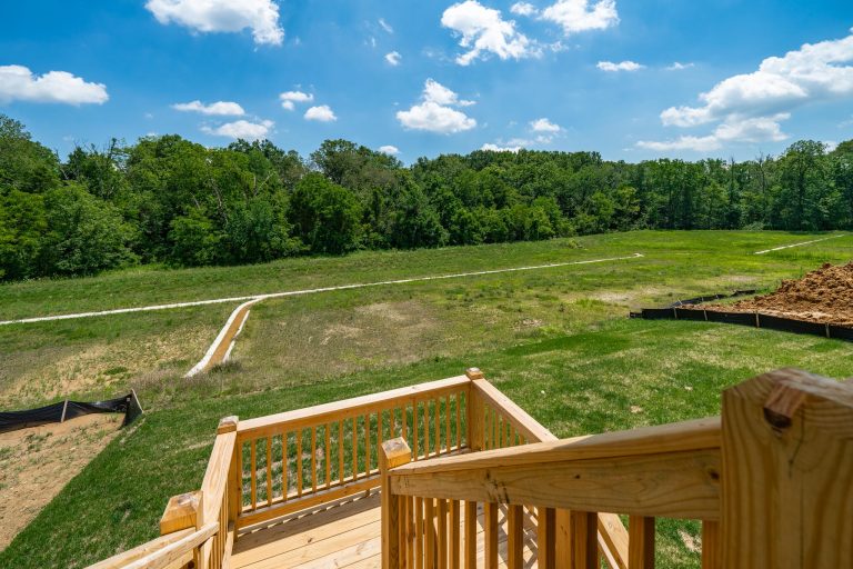 Transitional back porch photo in Huntington with decking and a roof extension by Bentley Construction LLC | Outdoor Photos | Porch | Landscaping | Landscape Design | Outdoor Living Space | Porch Design Ideas | Outdoor Living Space Ideas | Backyard Design