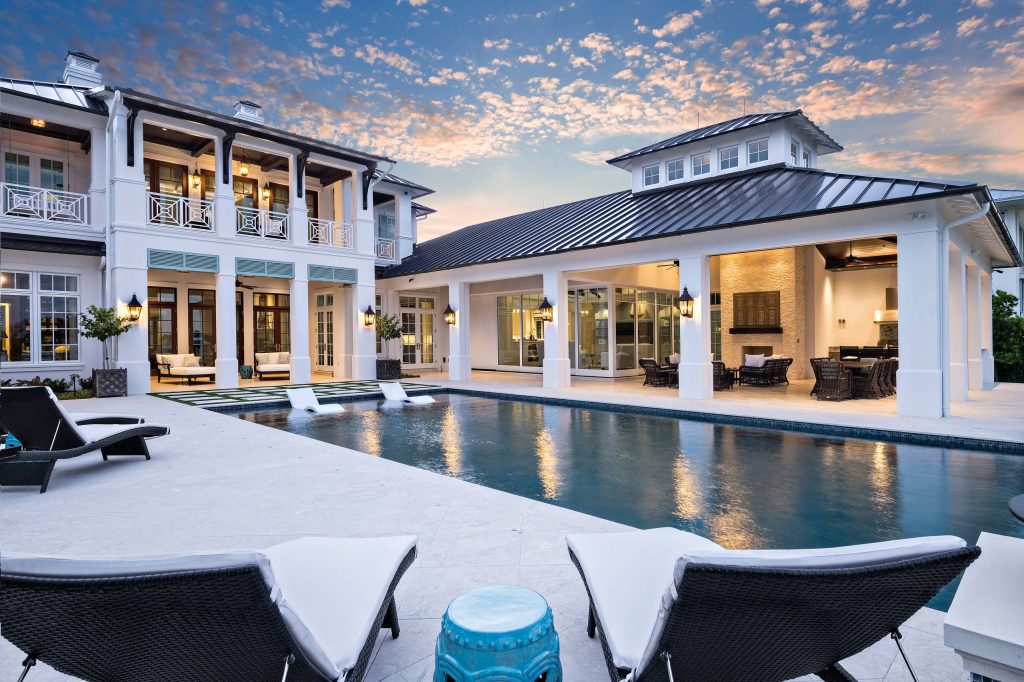 Transitional backyard concrete and rectangular pool photo in Miami