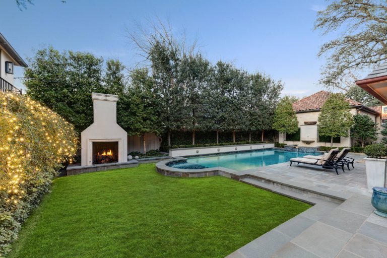 Transitional backyard concrete paver and rectangular lap pool fountain photo in Dallas