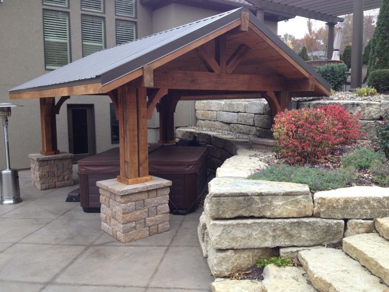 Transitional concrete patio kitchen photo in Kansas City with a gazebo