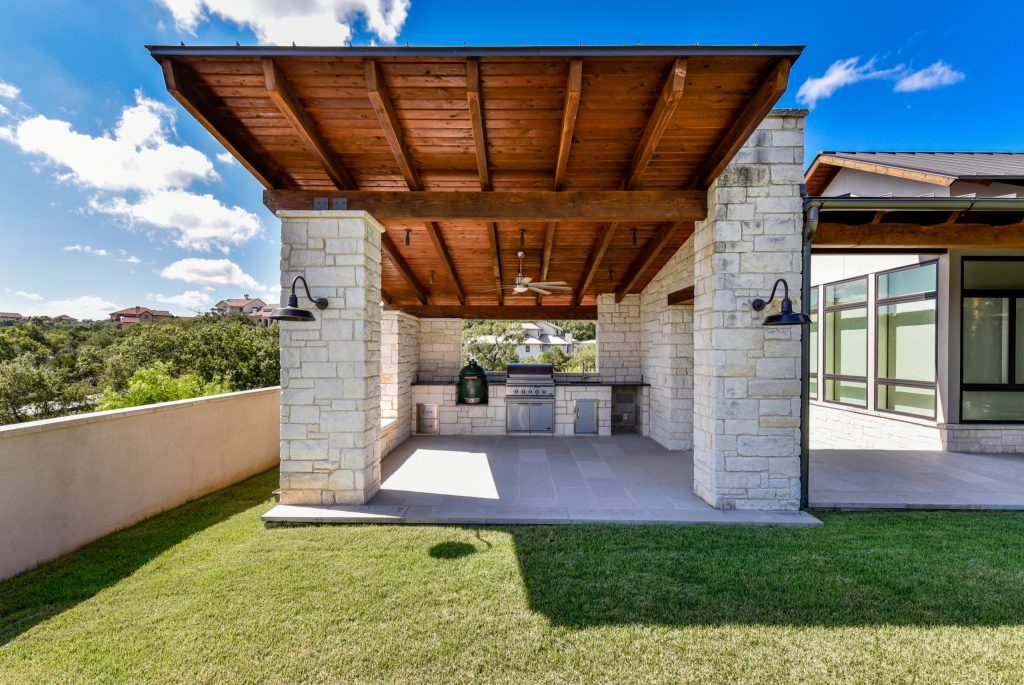 Transitional outdoor kitchen porch photo in Austin by Cornerstone Architects | Outdoor Photos | Porch | Landscaping | Landscape Design | Outdoor Living Space | Porch Design Ideas | Outdoor Living Space Ideas | Backyard Design
