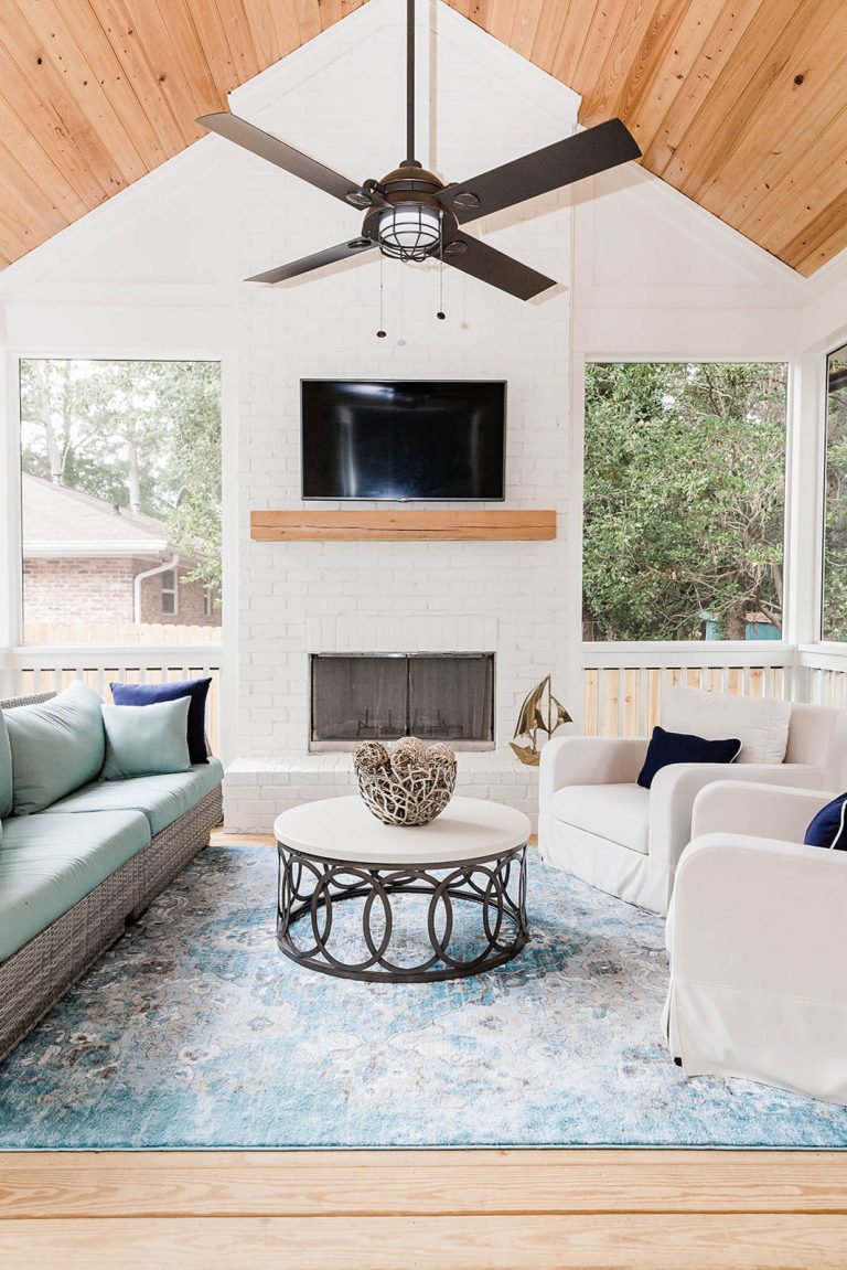 Transitional porch photo in Atlanta with a roof extension, a fireplace and decking by Katy Costner Interiors | Outdoor Photos | Porch | Landscaping | Landscape Design | Outdoor Living Space | Porch Design Ideas | Outdoor Living Space Ideas | Backyard Design