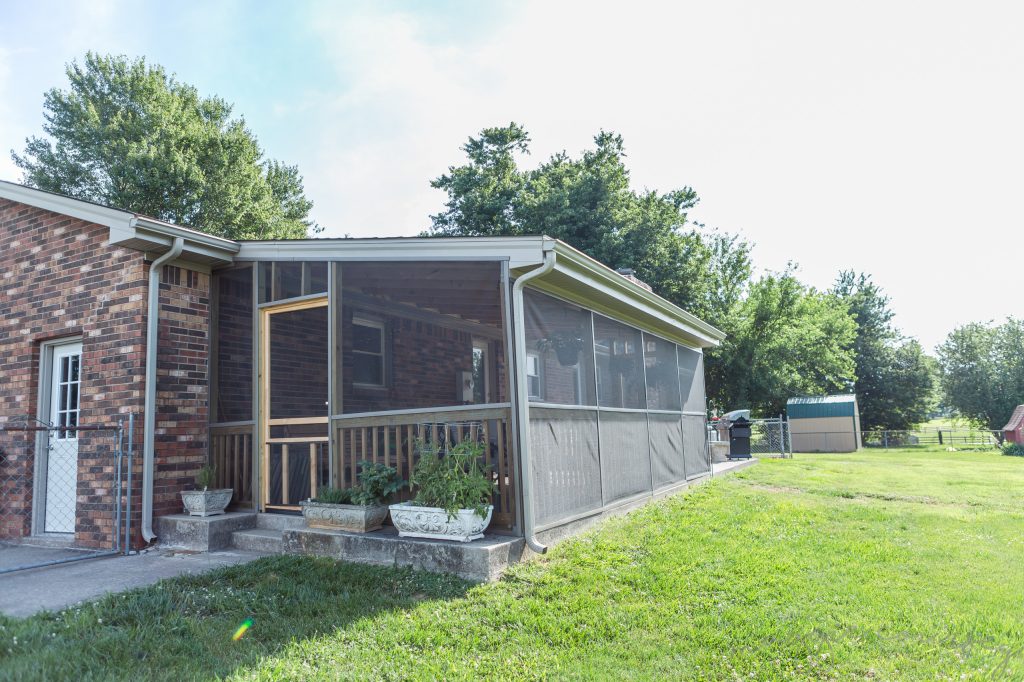 Transitional porch photo in Louisville by Lyman Quality Builders | Outdoor Photos | Porch | Landscaping | Landscape Design | Outdoor Living Space | Porch Design Ideas | Outdoor Living Space Ideas | Backyard Design