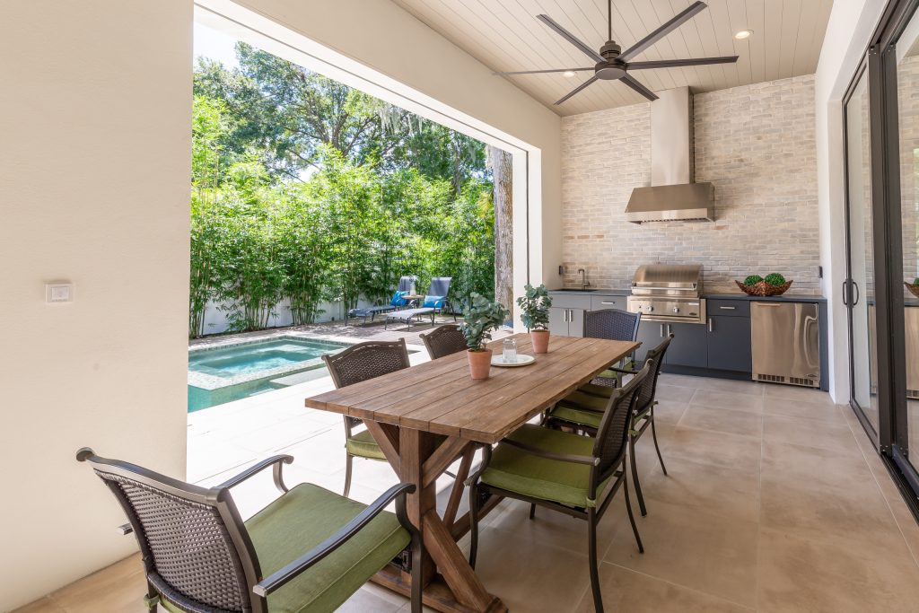 Transitional porch photo in Orlando by Verge Properties | Outdoor Photos | Porch | Landscaping | Landscape Design | Outdoor Living Space | Porch Design Ideas | Outdoor Living Space Ideas | Backyard Design