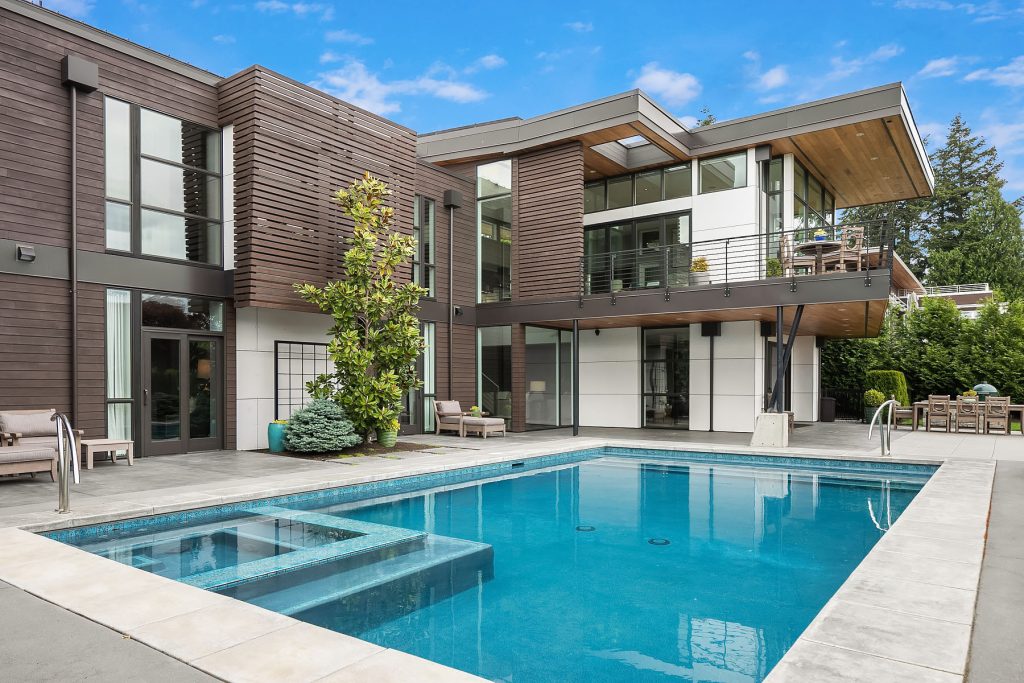 Trendy backyard concrete and rectangular hot tub photo in Seattle