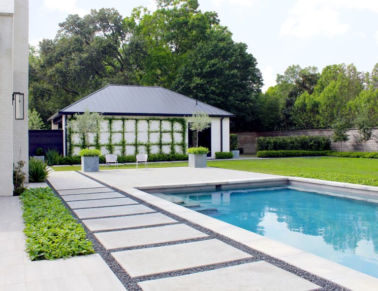 Trendy backyard concrete paver and rectangular pool house photo in Houston