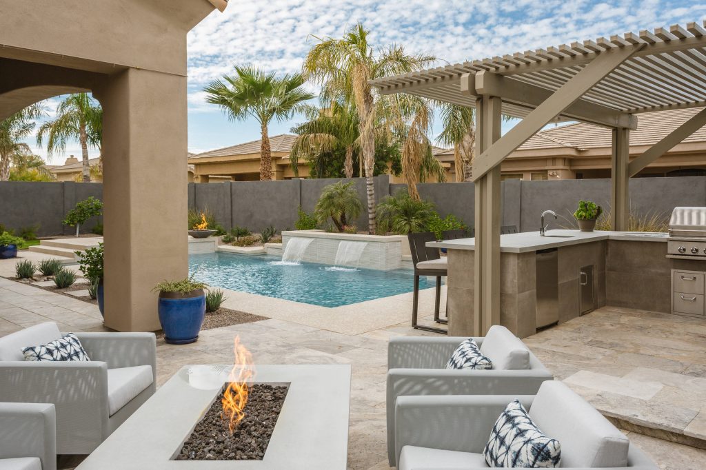 Trendy backyard patio kitchen photo in Phoenix with a pergola