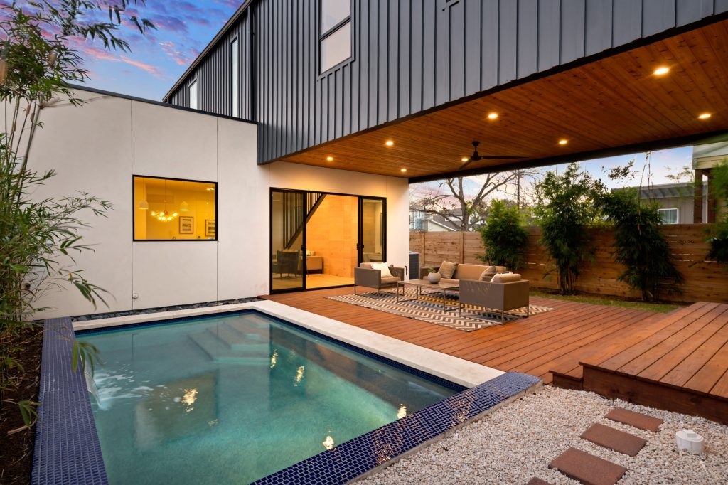 Trendy backyard tile and rectangular pool photo in Austin