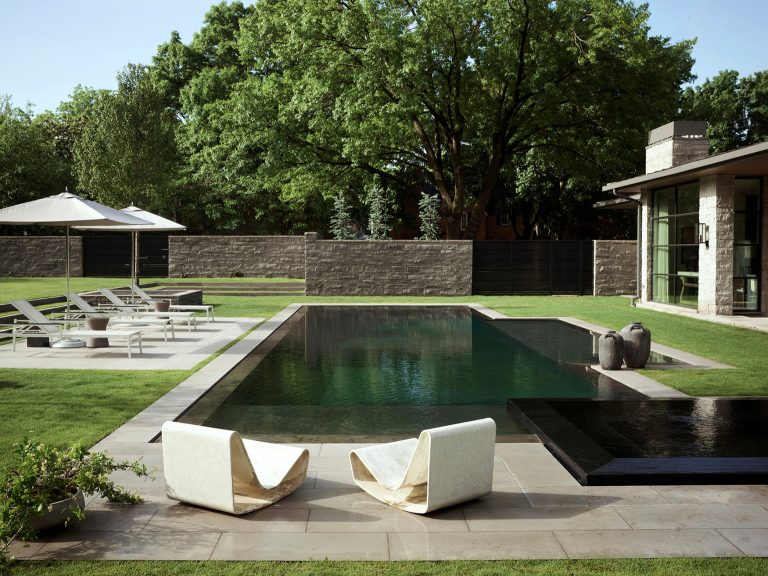 Trendy concrete and rectangular pool photo in Dallas