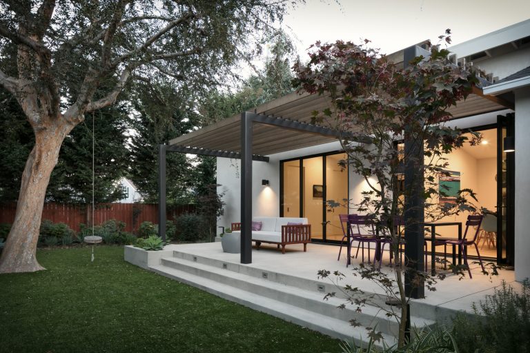 Trendy concrete back porch idea in Los Angeles with a pergola by SweisKloss | Outdoor Photos | Porch | Landscaping | Landscape Design | Outdoor Living Space | Porch Design Ideas | Outdoor Living Space Ideas | Backyard Design
