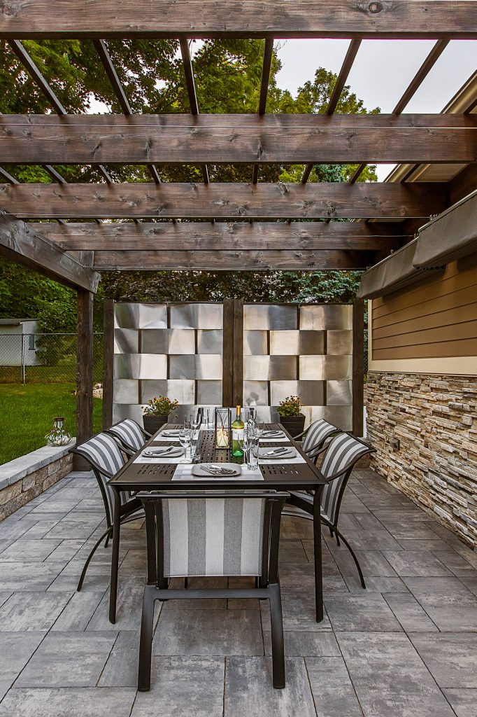 Trendy patio kitchen photo in Detroit with a pergola