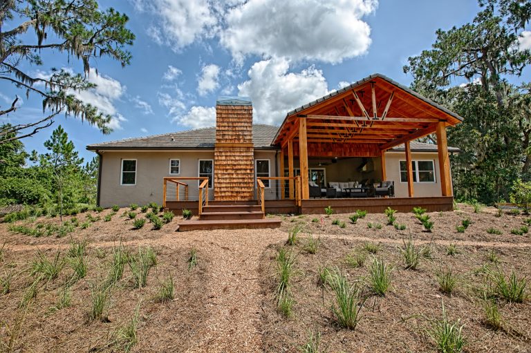 Trendy porch photo in Orlando by The Hauff Company | Outdoor Photos | Porch | Landscaping | Landscape Design | Outdoor Living Space | Porch Design Ideas | Outdoor Living Space Ideas | Backyard Design